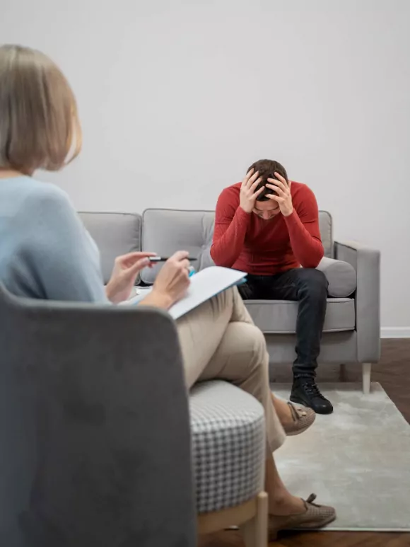 Clinician meeting with a patient during a therapy session